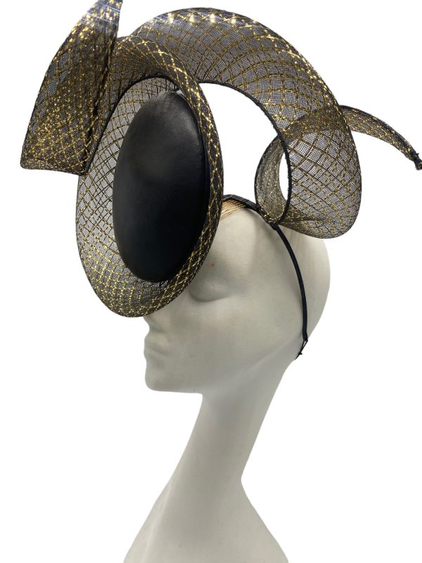 Black leather percher with black/gold window crin detail in a swirl design.
